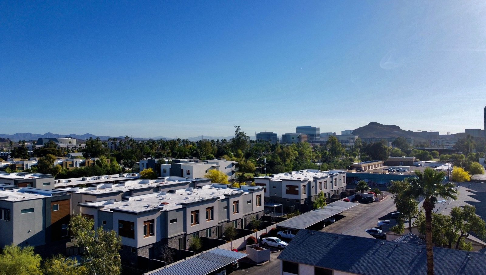 Multifamily community aerial with Tempe skyline
