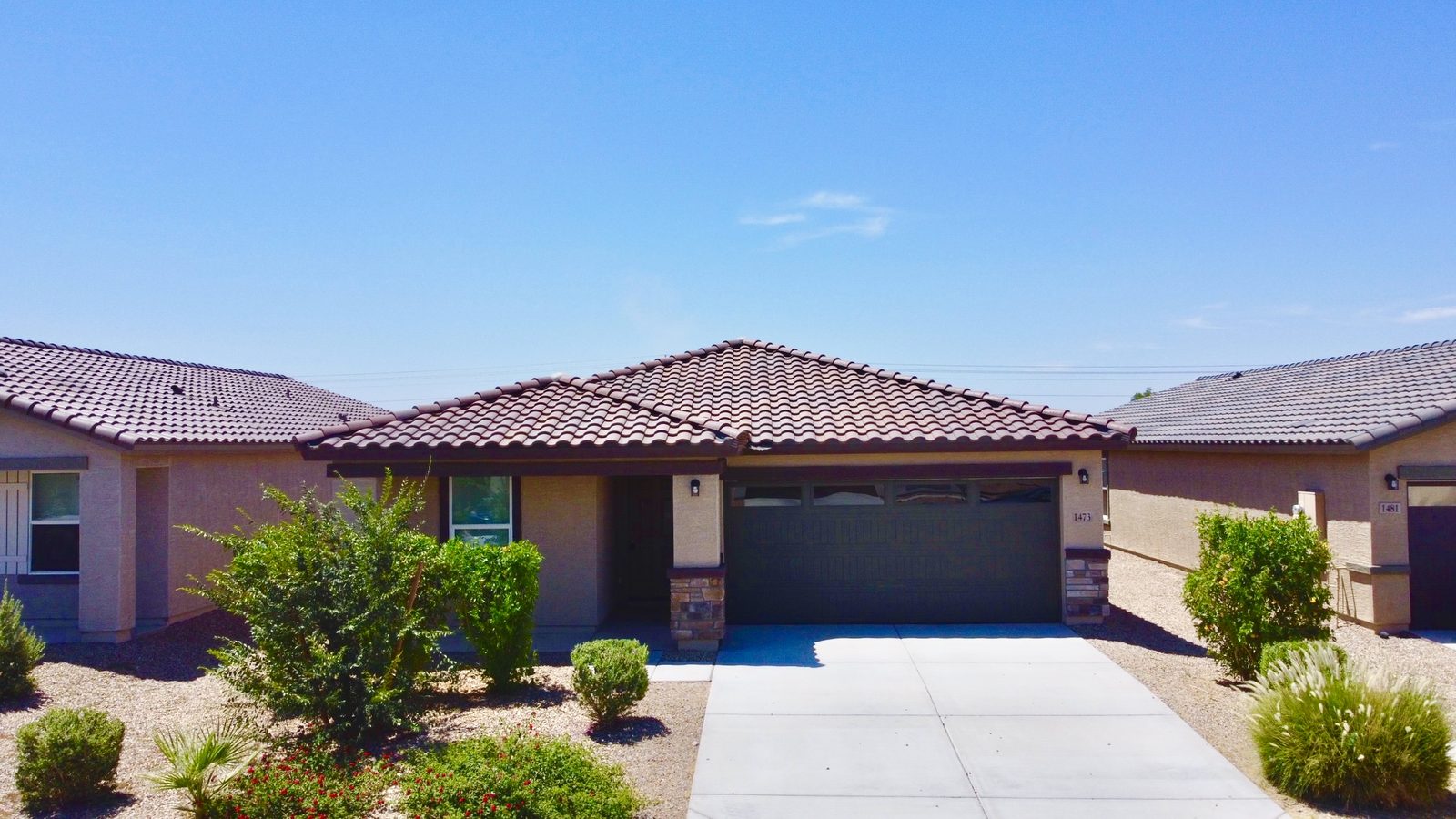 Elevated front view of new-build home for listing