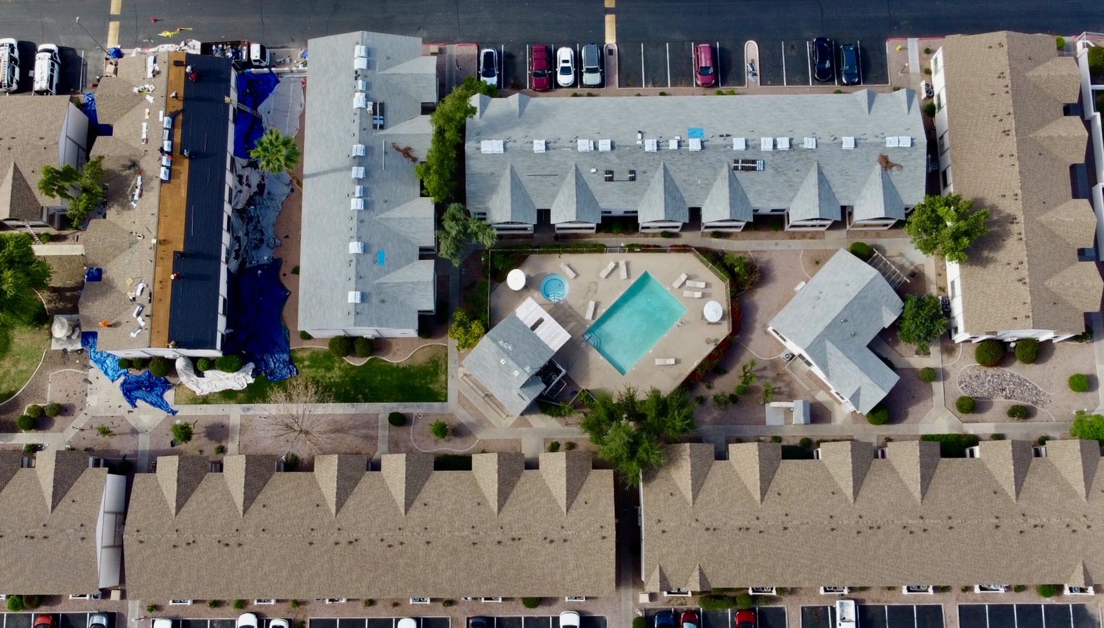 Top-down drone survey of multifamily property with pool